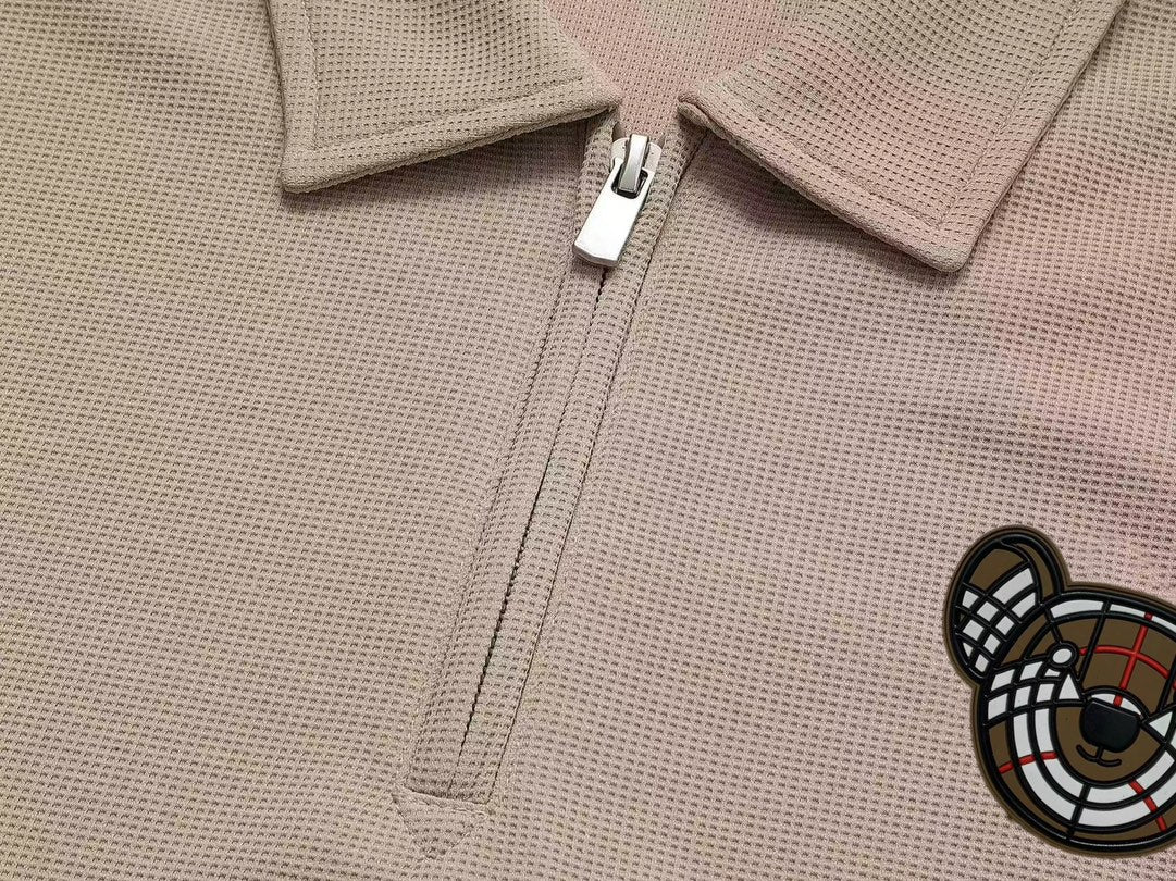 BURBERRY Waffle-Knit Polo Shirt with Contrast Sleeve Logo Patch Unisex M–3XL