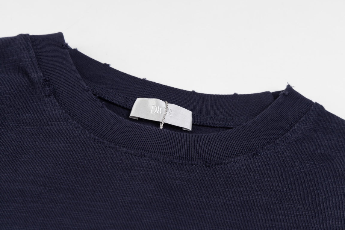 Elevate your wardrobe with the DIOR SS24 “47” Logo Print T-Shirt, a modern staple crafted with Dior’s signature precision and luxury.