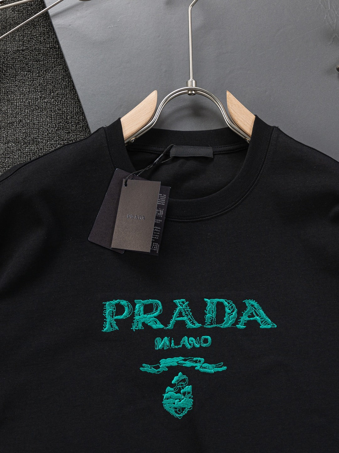 PRADA 25SS Oversized Embroidered Logo T-Shirt with Metal Triangle Badge | S–XL