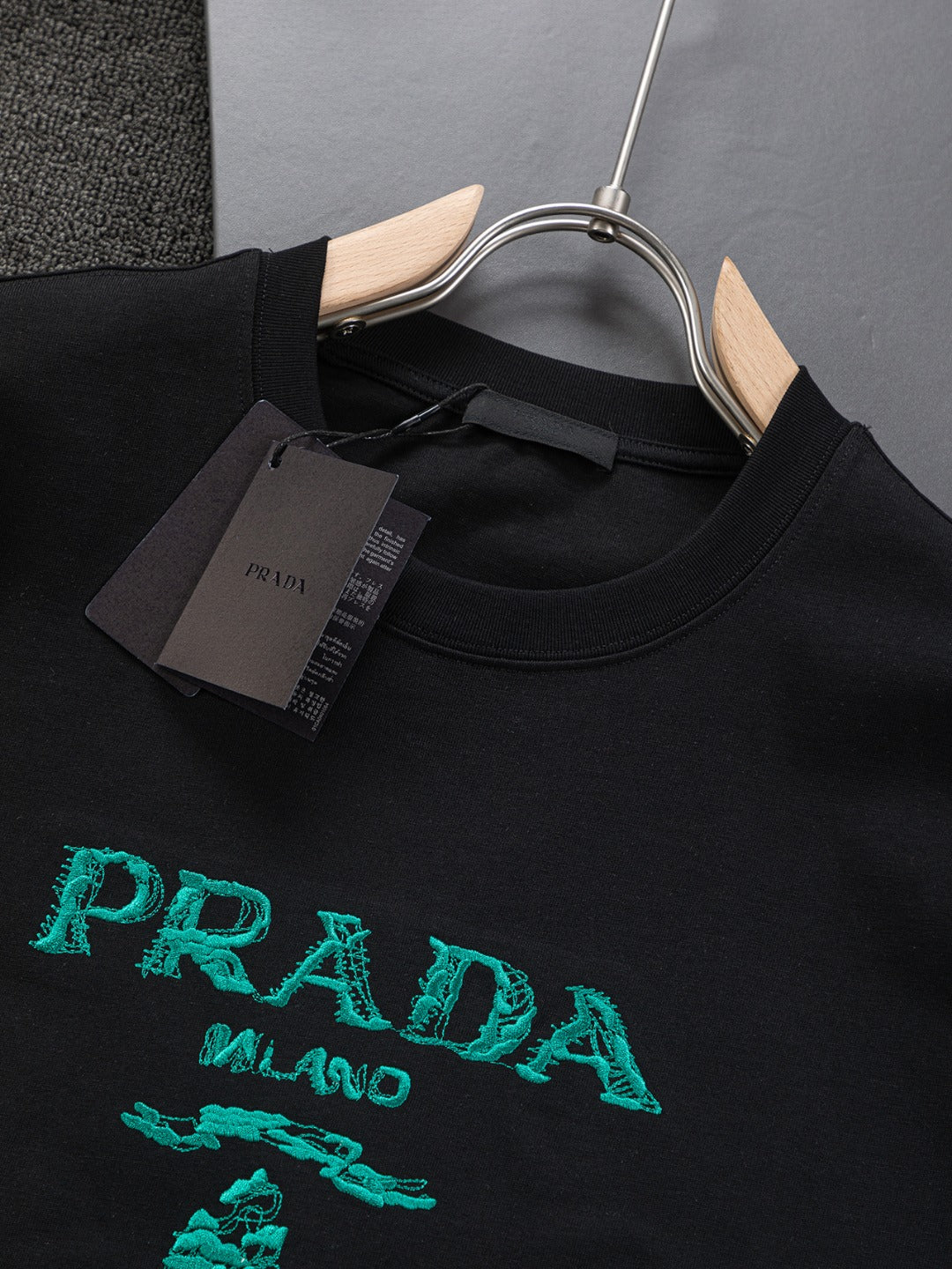 PRADA 25SS Oversized Embroidered Logo T-Shirt with Metal Triangle Badge | S–XL