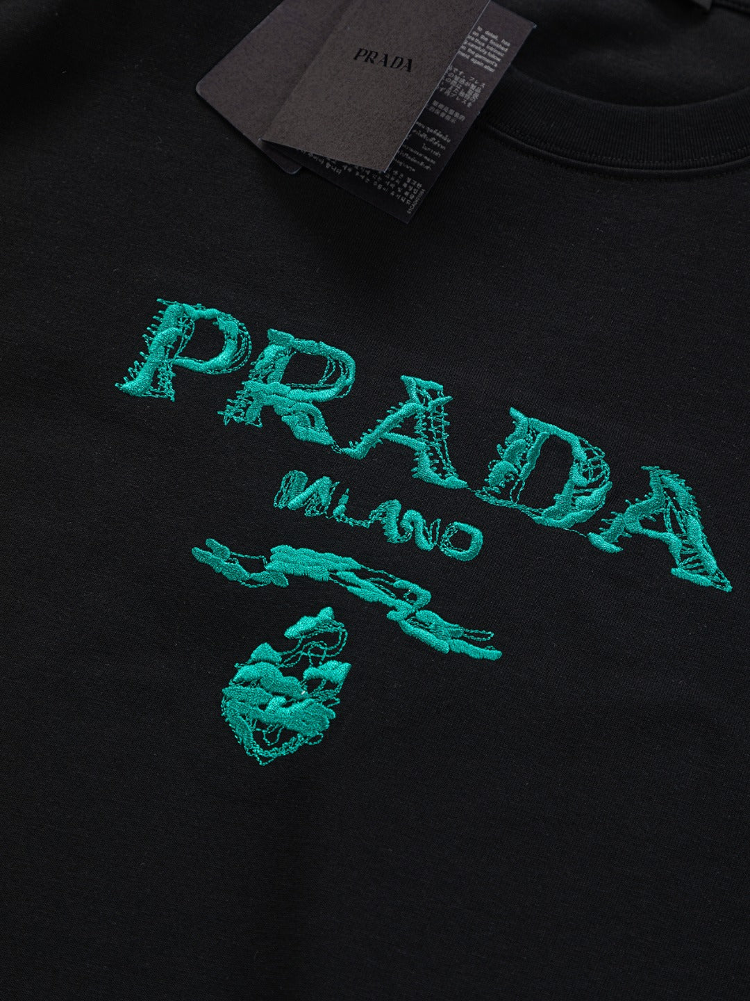 PRADA 25SS Oversized Embroidered Logo T-Shirt with Metal Triangle Badge | S–XL