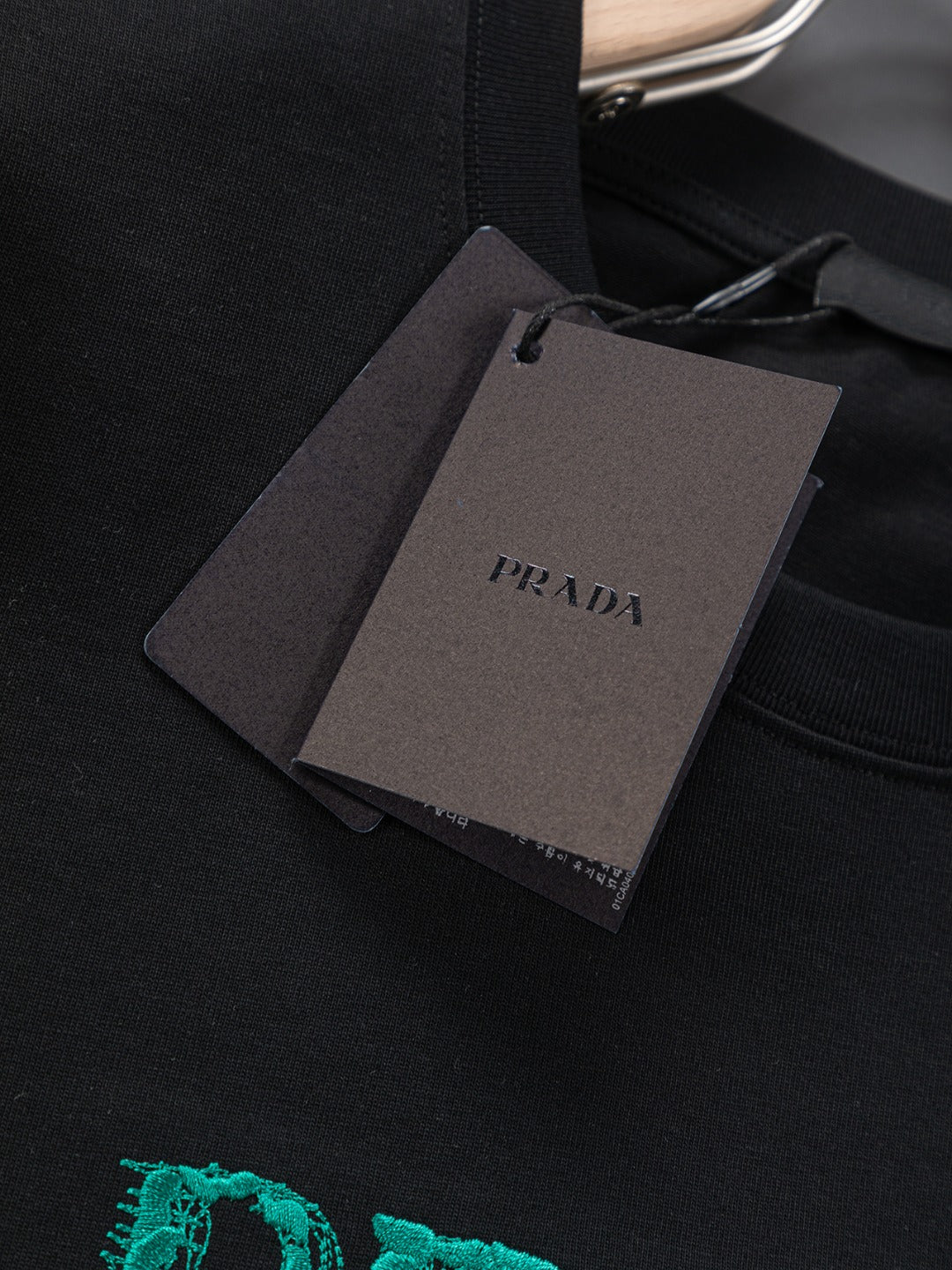 PRADA 25SS Oversized Embroidered Logo T-Shirt with Metal Triangle Badge | S–XL