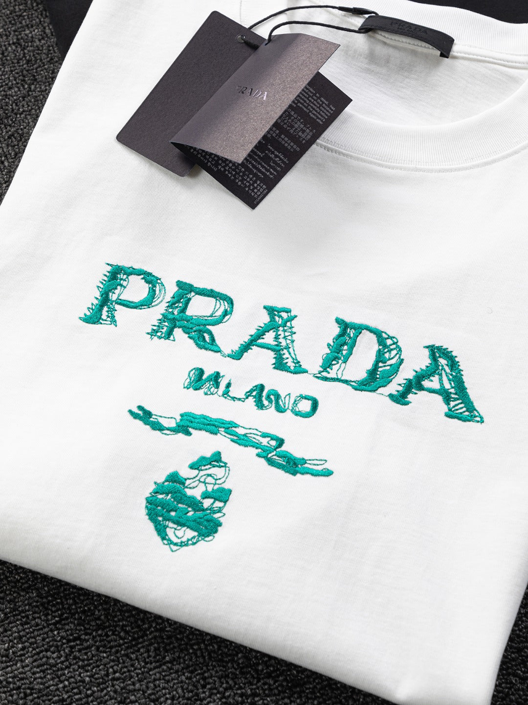 PRADA 25SS Oversized Embroidered Logo T-Shirt with Metal Triangle Badge | S–XL