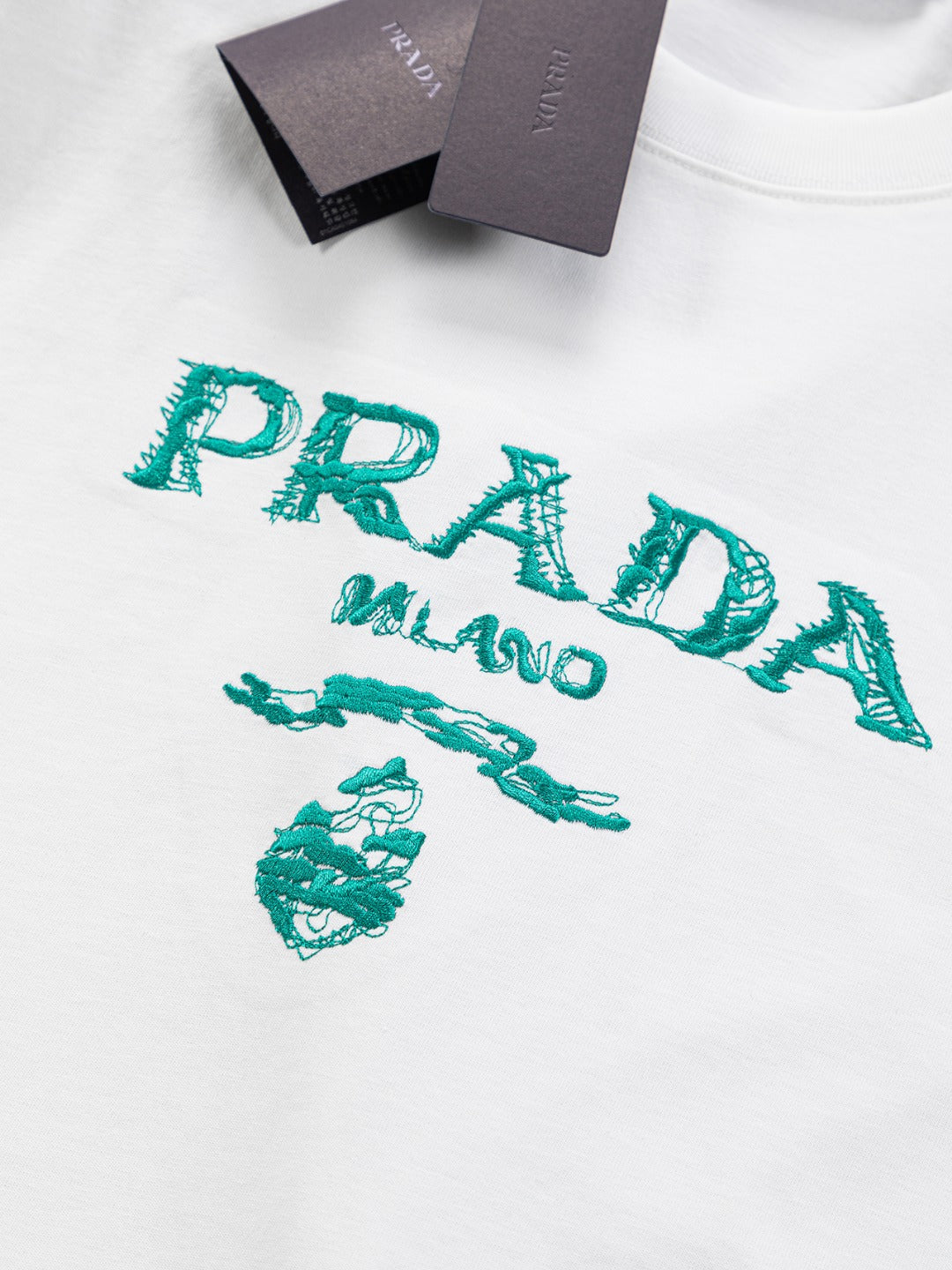 PRADA 25SS Oversized Embroidered Logo T-Shirt with Metal Triangle Badge | S–XL